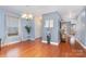 Dining room with hardwood floors, soft blue walls, and a decorative chandelier at 2005 Dunsmore Ln, Waxhaw, NC 28173