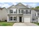 Charming two-story home with gray siding, black shutters, a well-kept lawn, and attached garage at 2005 Dunsmore Ln, Waxhaw, NC 28173