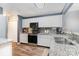 Well-equipped kitchen with white cabinets, stainless steel appliances, and granite countertops at 2005 Dunsmore Ln, Waxhaw, NC 28173