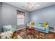Comfortable living room with a blue sofa, patterned rug, and soft lighting at 2005 Dunsmore Ln, Waxhaw, NC 28173