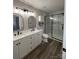 Bathroom featuring a double vanity, modern fixtures, and a glass-enclosed shower at 2006 Cramerton Village Dr # 31-D, Cramerton, NC 28032