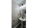 Bathroom features a sleek pedestal sink, modern fixtures, and is perfect for a half-bath layout at 2006 Cramerton Village Dr # 31-D, Cramerton, NC 28032