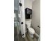 Half bathroom with functional toilet and modern storage cabinet, complete with a towel rack at 2006 Cramerton Village Dr # 31-D, Cramerton, NC 28032