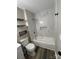 Beautiful bathroom with a shower and tub combo, complete with decorative shelves for storage at 2006 Cramerton Village Dr # 31-D, Cramerton, NC 28032