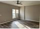 Cozy bedroom with hardwood floors, neutral walls, and ample natural light at 2006 Cramerton Village Dr # 31-D, Cramerton, NC 28032