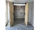Open closet with wooden barn doors and built-in shelving offers a large amount of storage space at 2006 Cramerton Village Dr # 31-D, Cramerton, NC 28032
