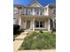 Charming townhome with a welcoming porch and well-maintained front yard at 2006 Cramerton Village Dr # 31-D, Cramerton, NC 28032