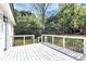 Exterior view of the back of the house featuring a white deck with black railings at 2038 Sandhurst Dr, Charlotte, NC 28205