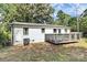 Exterior view of the back of the house featuring a small deck at 2038 Sandhurst Dr, Charlotte, NC 28205