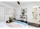 Comfortable bedroom featuring modern decor, dark wood floors, and an en-suite bathroom at 2038 Sandhurst Dr, Charlotte, NC 28205