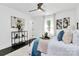 Bright bedroom with dark hardwood floors, eye-catching art, and neutral-toned decor at 2038 Sandhurst Dr, Charlotte, NC 28205