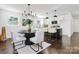 Open concept kitchen with a breakfast bar and connecting dining area at 2038 Sandhurst Dr, Charlotte, NC 28205