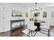 Cozy dining space features modern decor, rich wood floors, and natural light from two windows at 2038 Sandhurst Dr, Charlotte, NC 28205