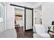 Interior view showcasing a modern barn door feature enhancing the character of the space at 2038 Sandhurst Dr, Charlotte, NC 28205