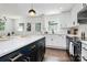 Modern eat-in kitchen with a large island, white countertops, and shaker cabinets at 2038 Sandhurst Dr, Charlotte, NC 28205