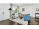 Inviting living room with neutral walls, a large window, hardwood floors, and stylish furniture at 2038 Sandhurst Dr, Charlotte, NC 28205