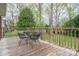 Cozy back deck with metal table and chairs, perfect for outdoor dining at 205 Gamble Ave, Bessemer City, NC 28016