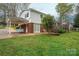 Exterior view of a brick and white home with a covered patio at 205 Gamble Ave, Bessemer City, NC 28016