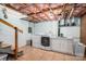 Unfinished basement with washer, dryer, and utility sink at 205 Gamble Ave, Bessemer City, NC 28016