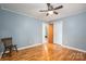 Bedroom with hardwood floors, closet, and doorway to another room at 205 Gamble Ave, Bessemer City, NC 28016