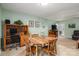 Cozy dining area features a wood table, office nook, and access to the outdoors at 205 Gamble Ave, Bessemer City, NC 28016
