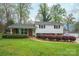 Charming two-story home with manicured front yard and traditional architectural details at 205 Gamble Ave, Bessemer City, NC 28016