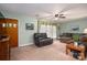 Comfortable living room features a cozy chair and ample natural light at 205 Gamble Ave, Bessemer City, NC 28016