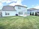 A spacious backyard featuring a well-maintained lawn, outdoor patio, and barbecue area, perfect for entertaining at 2052 Donaldson St, Indian Land, SC 29707