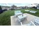 Landscaped backyard patio area featuring modern outdoor furniture set and an expansive green space at 2052 Donaldson St, Indian Land, SC 29707