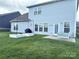A spacious backyard featuring a well-maintained lawn, outdoor patio, and barbecue area, perfect for entertaining at 2052 Donaldson St, Indian Land, SC 29707