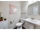Stylish half-bath with a pedestal sink and modern fixtures at 2052 Donaldson St, Indian Land, SC 29707