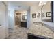 Expansive bathroom with dual vanities, granite counters, tiled floors, and a separate shower area at 2052 Donaldson St, Indian Land, SC 29707