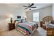 Bright bedroom showcasing a cozy bed, colorful linens, natural light, and classic furnishings at 2052 Donaldson St, Indian Land, SC 29707