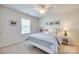 Serene bedroom with a queen bed, soft pillows, and a bedside table, illuminated by a table lamp at 2052 Donaldson St, Indian Land, SC 29707