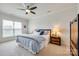 Inviting bedroom with a comfortable bed, soft linens, ceiling fan, and natural light from the window at 2052 Donaldson St, Indian Land, SC 29707