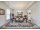 Formal dining room featuring wainscoting, a tray ceiling and chandelier lighting at 2052 Donaldson St, Indian Land, SC 29707