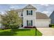 Charming two-story home featuring blue shutters, green lawn, and attached garage at 2052 Donaldson St, Indian Land, SC 29707