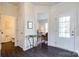 Elegant foyer showcasing dark hardwood floors, a decorative table, and a view into the living area at 2052 Donaldson St, Indian Land, SC 29707