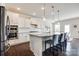 Bright kitchen boasts white cabinets, granite counters, and stainless steel appliances at 2052 Donaldson St, Indian Land, SC 29707