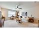 Bright living room with a ceiling fan, comfortable sofa, complementary art and a table with chairs by the window at 2052 Donaldson St, Indian Land, SC 29707