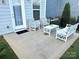 Inviting patio with white furniture, perfect for outdoor relaxation and entertaining guests at 2052 Donaldson St, Indian Land, SC 29707