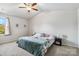 Bright primary bedroom featuring large windows, ceiling fan and neutral carpet at 213 Morton St, Shelby, NC 28152
