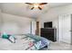 Light bedroom with a floral patterned bedspread, dresser and tv at 213 Morton St, Shelby, NC 28152