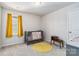 Charming Bedroom featuring a crib, yellow rug and bright window at 213 Morton St, Shelby, NC 28152