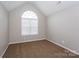 Bright, spacious bedroom with large window and neutral carpeting at 240 Bluffton Rd, Mooresville, NC 28115