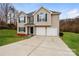 Charming two-story home featuring a two-car garage and well-maintained landscaping at 240 Bluffton Rd, Mooresville, NC 28115
