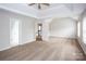 Spacious main bedroom features a tray ceiling, neutral carpet, and multiple windows at 240 Bluffton Rd, Mooresville, NC 28115