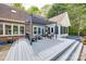 Well-appointed deck featuring comfortable seating under a pergola, adjacent to the sunroom and hot tub area at 2470 Highway 557 Rd, Clover, SC 29710