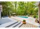 Spacious backyard with in-ground pool, lounge area, and lush landscaping, ideal for outdoor relaxation at 2470 Highway 557 Rd, Clover, SC 29710