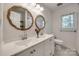 Bathroom with dual sinks, modern fixtures, a large mirror, and a window providing natural light at 2470 Highway 557 Rd, Clover, SC 29710